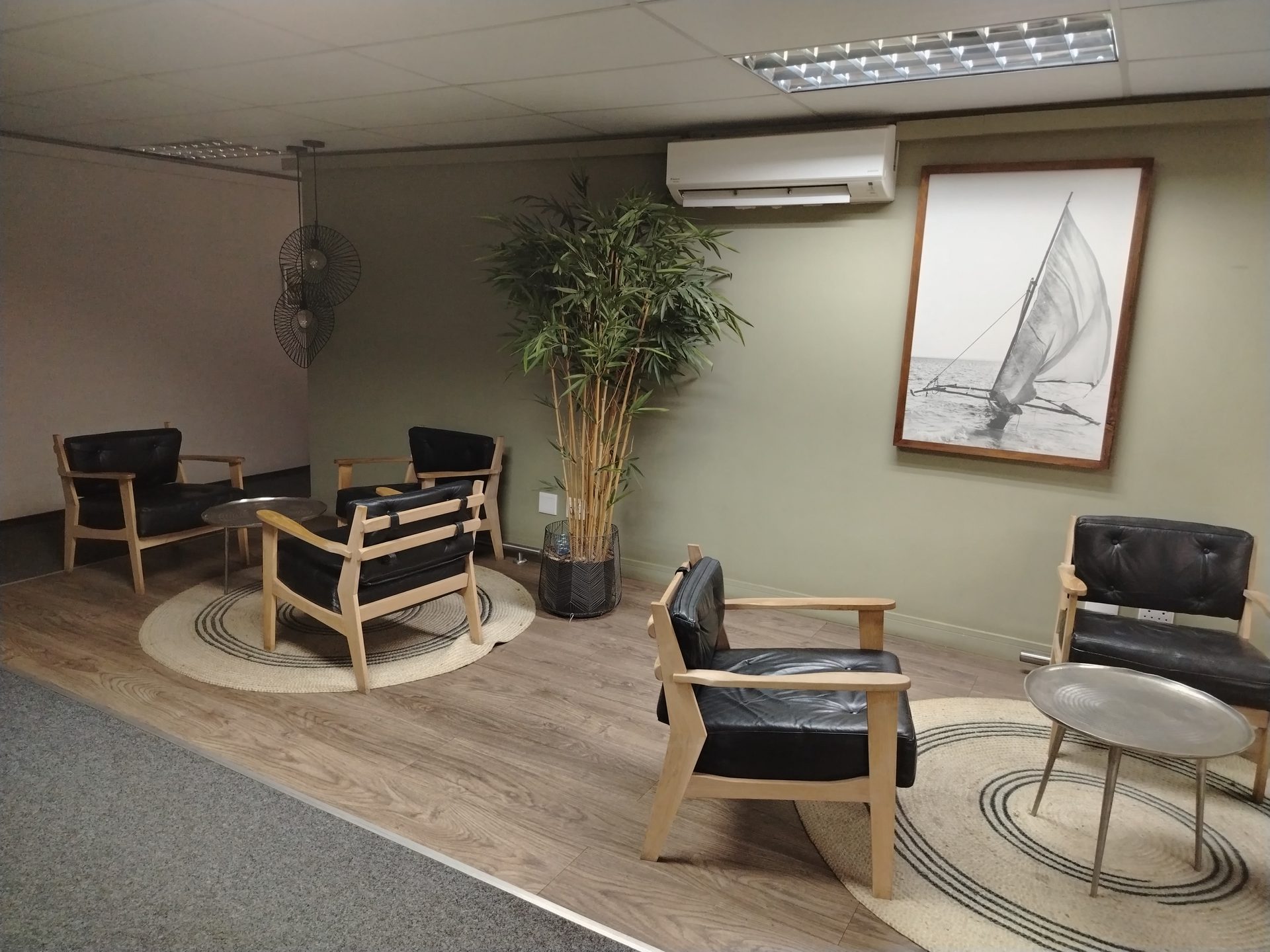 Esselen Towers tenant lounge with leather seating and timber floors